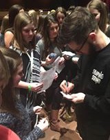 Travis Wall, of Shaping Sound signs our little dancer's ticket!