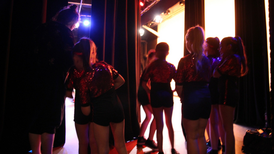 Dancers patiently waiting backstage for their chance to shine at our Night to Remember recital!