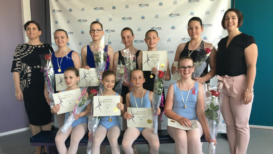 Dancers received their medals and certificates for their awards. 